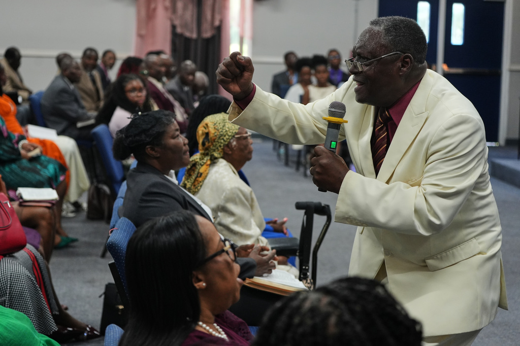 Roosevelt Toussaint, the senior pastor of the Word of Life Center church, delivers his sermon titled "What to do in a time of crisis?" at a service in Salisbury, Md., Sunday, Aug. 2, 2026. (AP Photo/Luis Andres Henao)