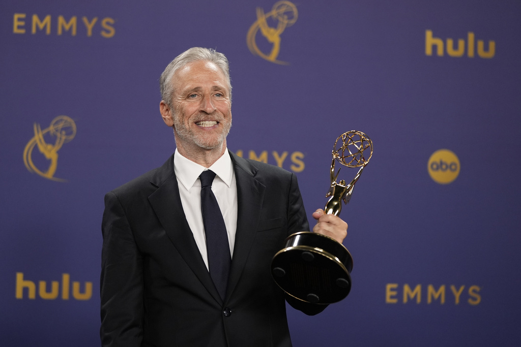 FILE - Jon Stewart poses in the press room with the award for outstanding talk series for "The Daily Show" during the 76th Primetime Emmy Awards on Sept. 15, 2024, at the Peacock Theater in Los Angeles. (AP Photo/Jae C. Hong, File)