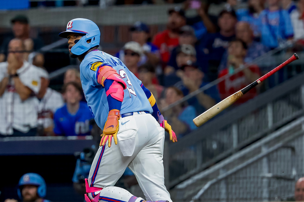 Atlanta Braves' Ronald Acuña Jr. (13) flips his bat after hitting a solo home run against the Philadelphia Phillies during the fourth inning of a baseball game, Saturday, Sept. 12, 2026, in Atlanta. (AP Photo/Erik S. Lesser)