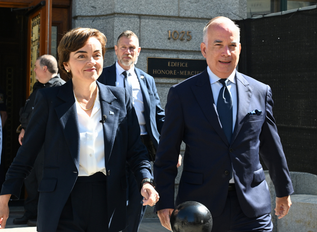 Coalition Avenir Quebec Leader Christine Frechette walks with her spouse Guy Nadeau heading to the Lt. Governor's office to launch a general election in Quebec City, on Thursday, Aug. 27, 2026. (Jacques Boissinot/The Canadian Press via AP)