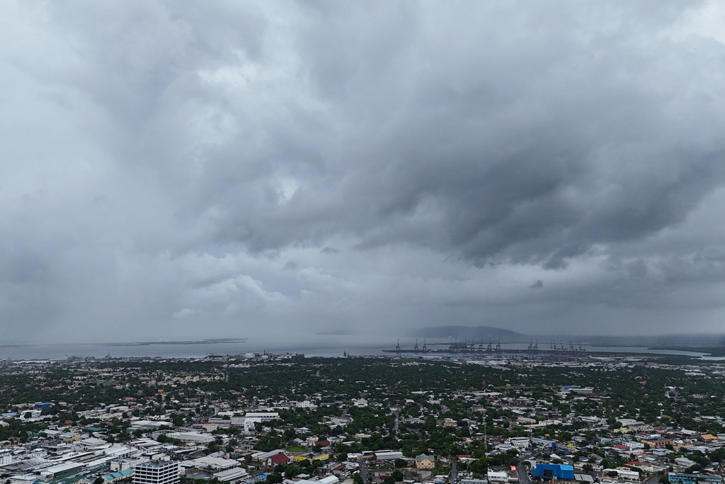 Clouds cover Kingston, Jamaica, ahead of the forecast arrival of Hurricane Melissa on Sunday, Oct. 26, 2025. (AP Photo/Matias Delacroix)