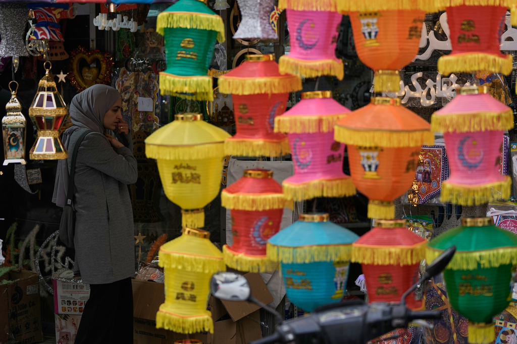 A woman shops for decorations in preparation for the upcoming Muslim holy month of Ramadan at a store in Beirut, Lebanon, Monday, Feb. 16, 2026. (AP Photo/Bilal Hussein)