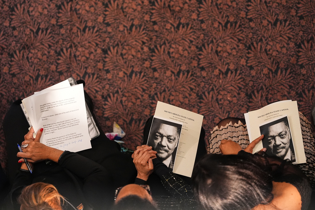 People gather inside the South Carolina Statehouse as the Rev. Jesse Jackson lies in state Monday, March 2, 2026, in Columbia, S.C. (AP Photo/Matt Kelley, Pool)