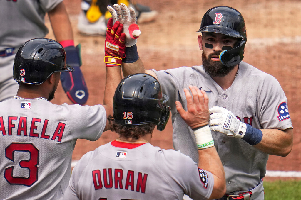 Boston Red Sox's Connor Wong, right, is high-fived by Ceddanne Rafaela (3) and Jarren Duran (16) as he returns to the dugout after hitting a three-run home run off Pittsburgh Pirates pitcher Hunter Barco during the fifth inning of a baseball game in Pittsburgh, Sunday, Aug. 16, 2026. (AP Photo/Gene J. Puskar)
