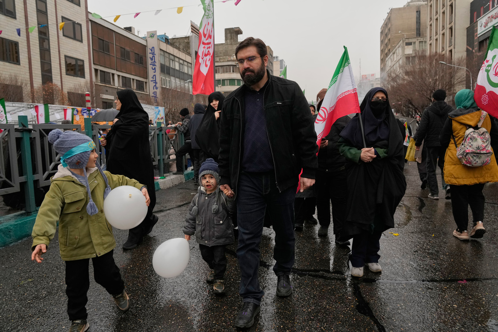 People attend a state-organised rally in Tehran, Iran, Wednesday, Feb. 4, 2026, celebrating the birthday of Imam Mahdi, or "Hidden Imam," a 9th-century saint whom Shiite Muslims believe will return at the end of time as a universal reformer to end tyranny and promote justice. (AP Photo/Vahid Salemi)