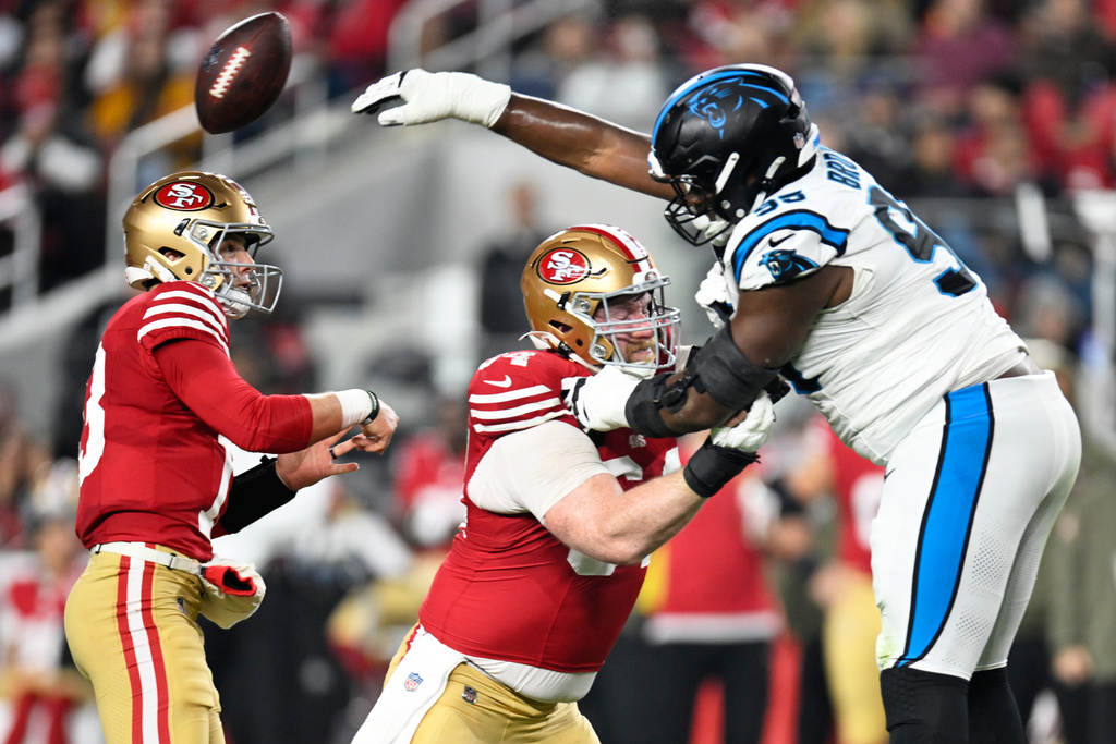 Carolina Panthers defensive end Derrick Brown blocks a pass by San Francisco 49ers quarterback Brock Purdy during the first half an NFL football game, Monday, Nov. 24, 2025, in Santa Clara, Calif. (AP Photo/Eakin Howard)