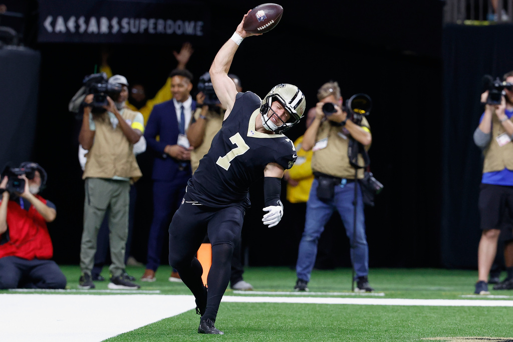 New Orleans Saints tight end Taysom Hill reacts after scoring a touchdown during the first half of an NFL football game against the New England Patriots, Sunday, Oct. 12, 2025, in New Orleans. (AP Photo/Butch Dill)