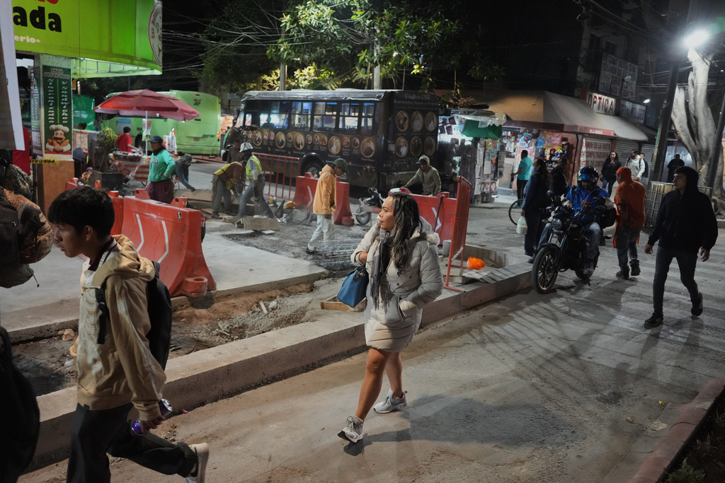 Montserrat Fuentes, a sex worker, arrives to Calzada de Tlalpan, the street in Mexico City where she has worked for the last 20 years and the city is building a bike lane in preparation for the World Cup that blocks cars from pulling over and cuts into the livelihoods of sex workers and street vendors, Tuesday, Feb. 10, 2026. (AP Photo/Eduardo Verdugo)