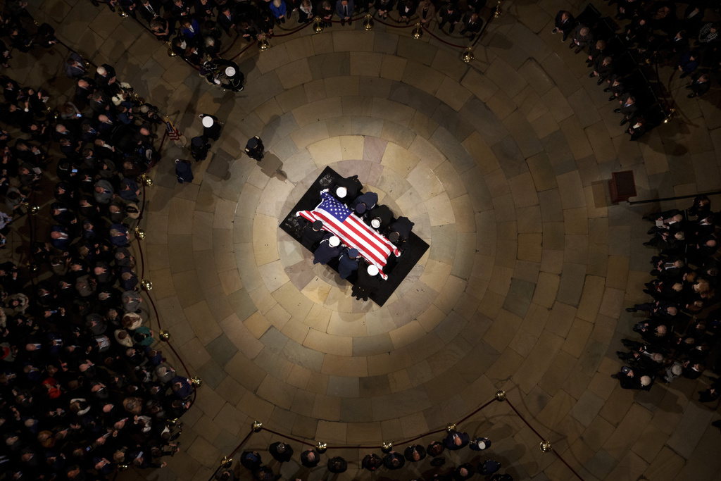 The flag-draped casket of former President Jimmy Carter lies in state at the rotunda of the U.S. Capitol Tuesday, Jan. 7, 2025, in Washington. (Andrew Harnik/Pool via AP)