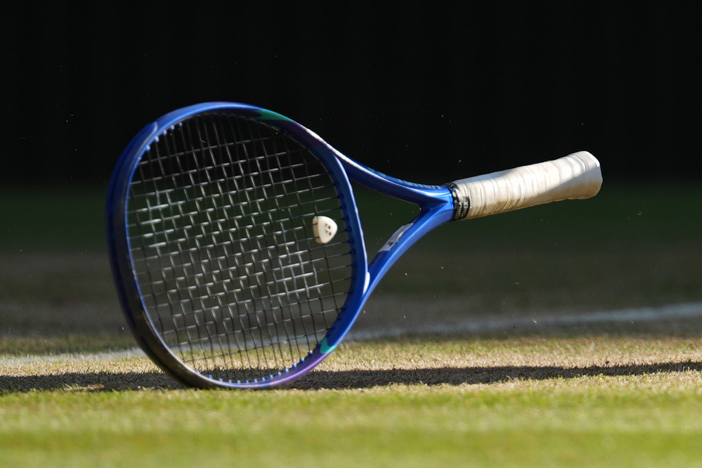 FILE - A tennis racket sits on the court at the Wimbledon Tennis Championships in London, July 11, 2026. (AP Photo/Kirsty Wigglesworth, File)