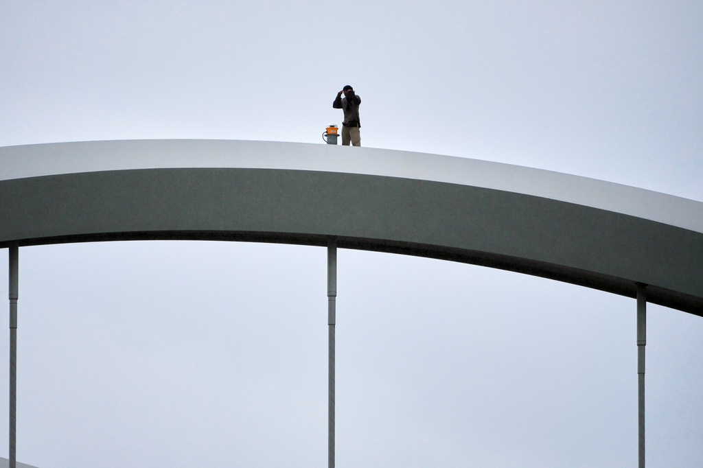 Guido Reichstadter, 45, is seen on top of the Frederick Douglass Bridge, Wednesday, May 6, 2026 in Washington. Reichstadter has come down, after his 6-day protest. (AP Photo/Julia Demaree-Nikhinson)