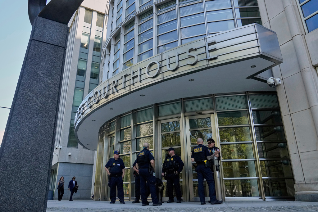 FILE - A group of Department of Homeland Security Police stand outside Federal court in the Brooklyn borough of New York, Aug. 25, 2025. (AP Photo/Richard Drew, File)