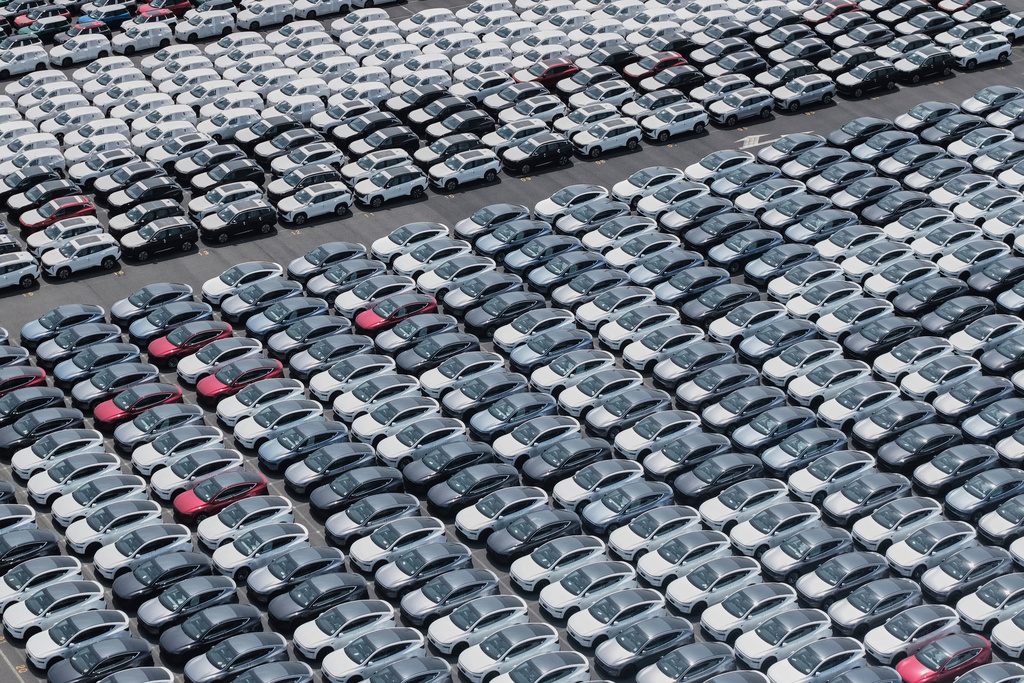 FILE -New cars for export wait for shipment at a port in Shanghai, China on May 11, 2025. (Chinatopix Via AP, File)