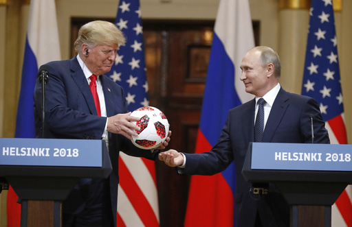 FILE - Russian President Vladimir Putin, right, gives a soccer ball to President Donald Trump during a press conference after their meeting at the Presidential Palace in Helsinki, Finland, July 16, 2018. (AP Photo/Alexander Zemlianichenko, File) FILE - Russian President Vladimir Putin, right, gives a soccer ball to President Donald Trump during a press conference after their meeting at the Presidential Palace in Helsinki, Finland, July 16, 2018. (AP Photo/Alexander Zemlianichenko, File)
