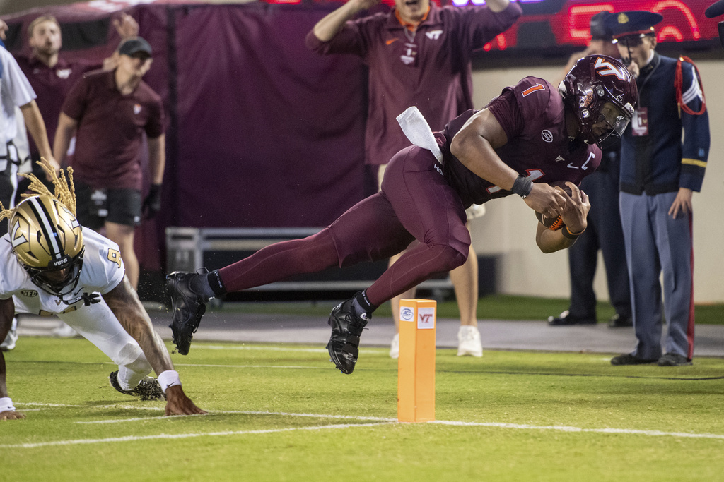 Virginia Tech quarterback Kyron Drones (1) runs the ball downfield against Vanderbilt during the first half of an NCAA college football game Saturday, Sept. 6, 2025, in Blacksburg, Va. (AP Photo/Robert Simmons)