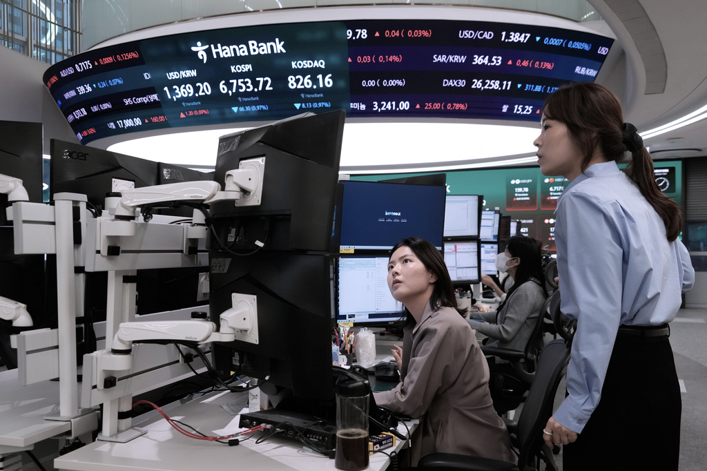 Currency traders watch monitors at the foreign exchange dealing room of the Hana Bank headquarters in Seoul, South Korea, Tuesday, Sept. 1, 2026. (AP Photo/Ahn Young-joon)