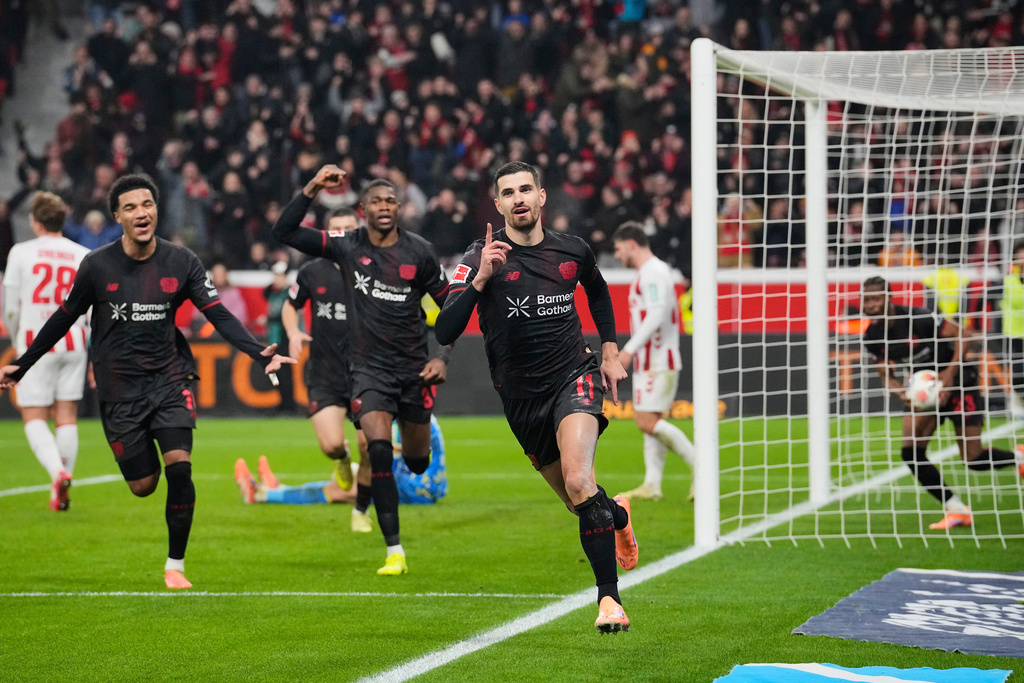 Leverkusen's Martin Terrier celebrates after he scored the opening goal during the German Bundesliga soccer match between Bayer 04 Leverkusen and 1.FC Cologne in Leverkusen, Germany, Saturday, Dec. 13, 2025. (AP Photo/Martin Meissner)
