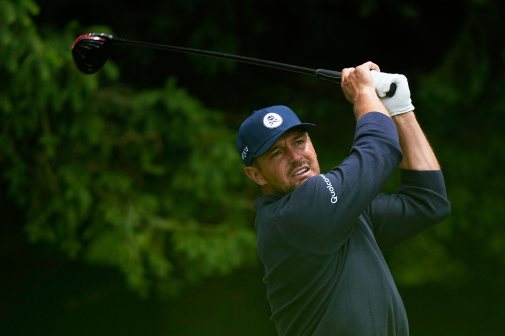 Bryson DeChambeau watches his tee shot on the fourth hole during the first round of the PGA Championship golf tournament practice round at Aronimink Golf Club, Thursday, May 14, 2026, in Newtown Square, PA. (AP Photo/Matt Slocum)