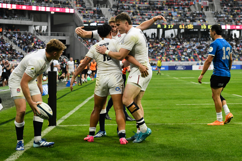 England's Marcus Smith, center left, celebrates with teammates after scoring a try against Argentina during a Nations Championship rugby match in Santiago Del Estero, Argentina, Saturday, July 18, 2026. (AP Photo/Gustavo Garello)
