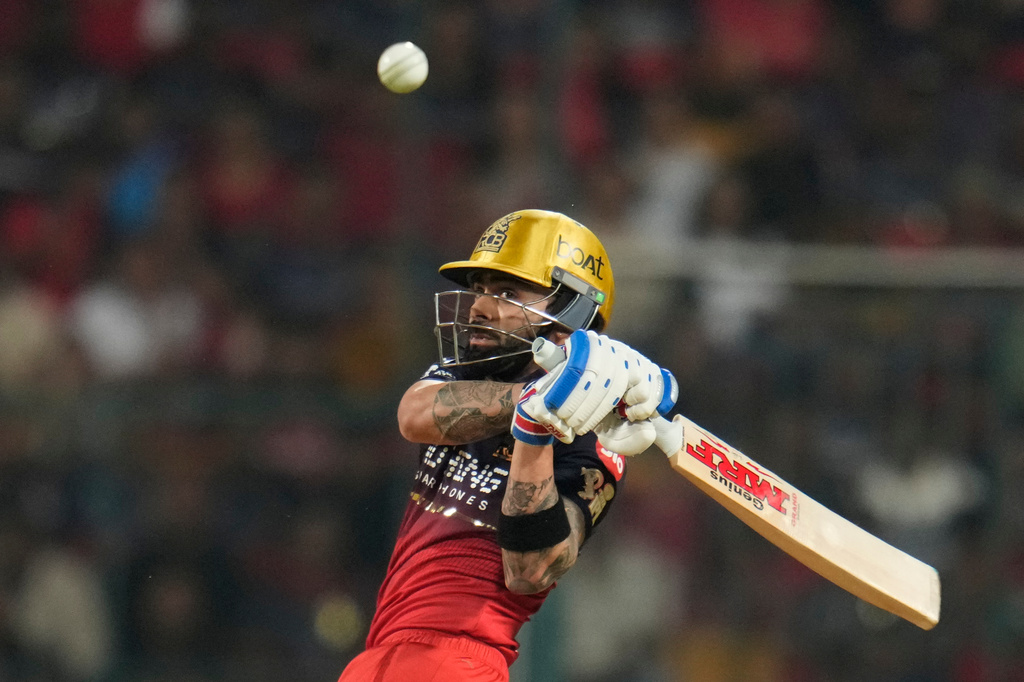 Royal Challengers Bengaluru's Virat Kohli hits a boundary during the Indian Premier League cricket match between Royal Challengers Bengaluru and Lucknow Super Giants in Bengaluru, India, Wednesday, April 15, 2026. (AP Photo/Aijaz Rahi)