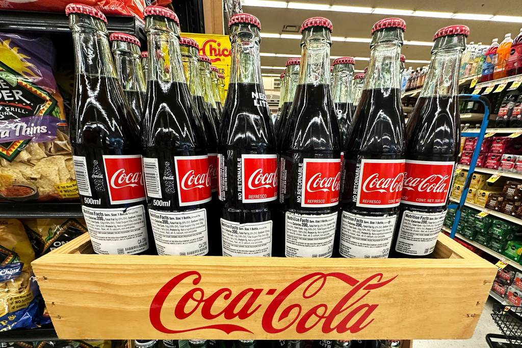 FILE - Bottles of Mexican Coca-Cola are displayed at a grocery store in Mount Prospect, Ill., Thursday, July 17, 2025. (AP Photo/Nam Y. Huh, File)