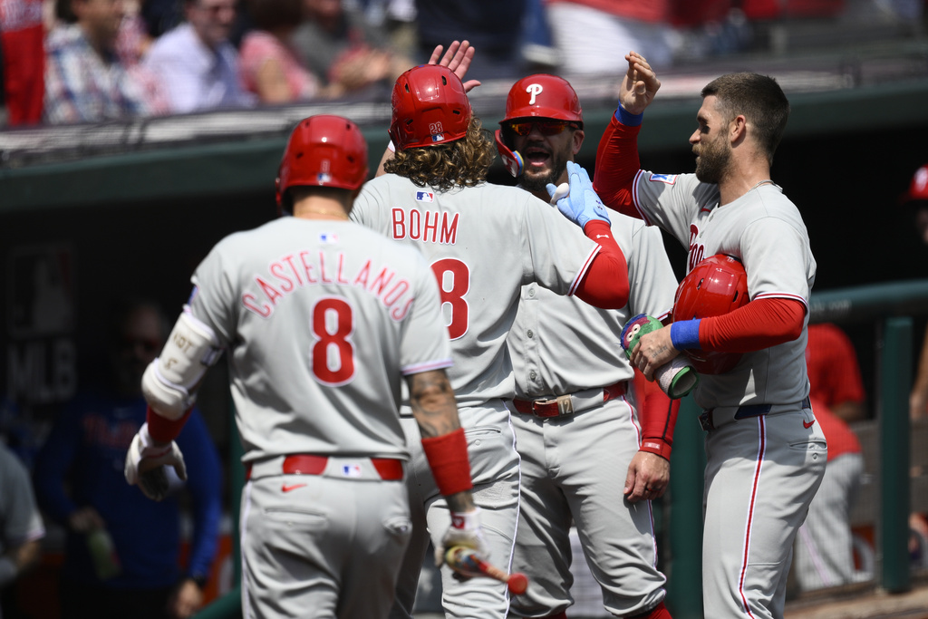 Philadelphia Phillies' Alec Bohm (28) celebrates his three-run home run with teammates during the second inning of a baseball game against the Washington Nationals, Sunday, Aug. 17, 2025, in Washington. (AP Photo/Nick Wass)