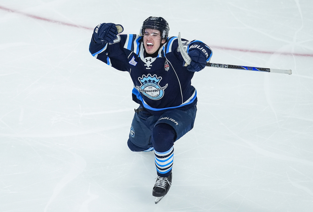 Chicoutimi Sagueneens' Liam Lefebvre (39) celebrates his winning goal during the first overtime period of a Memorial Cup hockey game against the Kelowna Rockets in Kelowna, British Columbia, Sunday, May 24, 2026. (Darryl Dyck/The Canadian Press via AP)