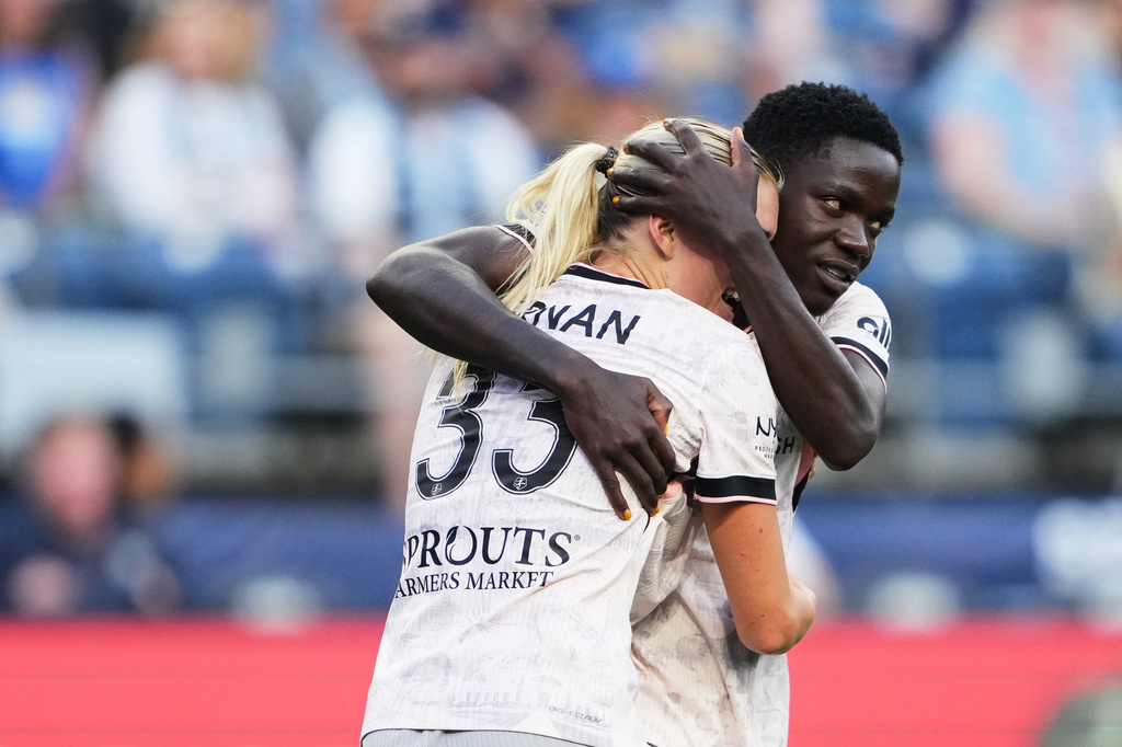 Angel City FC forward Prisca Chilufya, right, hugs teammate Riley Tiernan, left, to celebrate her goal against Seattle Reign FC during the second half of an NWSL soccer match, Sunday, Aug. 9, 2026, in Seattle. (AP Photo/Lindsey Wasson)