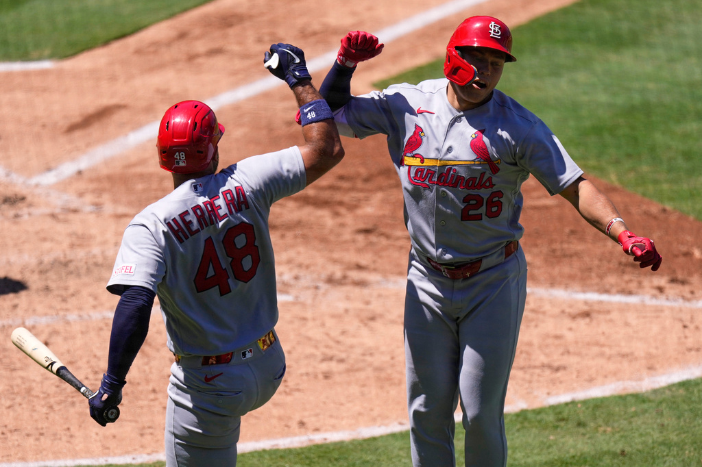 St. Louis Cardinals' JJ Wetherholt, right, is congratulated by Iván Herrera after hitting a solo home run during the sixth inning of a baseball game against the Los Angeles Angels, Wednesday, July 22, 2026, in Anaheim, Calif. (AP Photo/Mark J. Terrill)