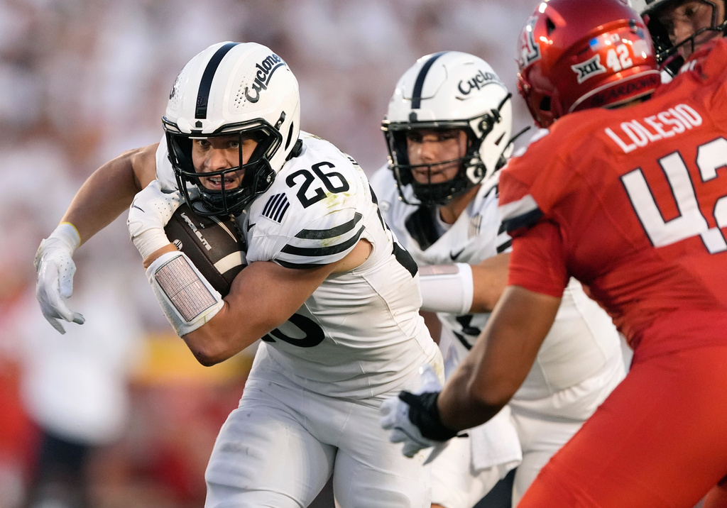 Iowa State running back Carson Hansen (26) runs the ball against Arizona during the first half of an NCAA college football game, Saturday, Sept. 27, 2025, in Ames, Iowa. (AP Photo/Matthew Putney)
