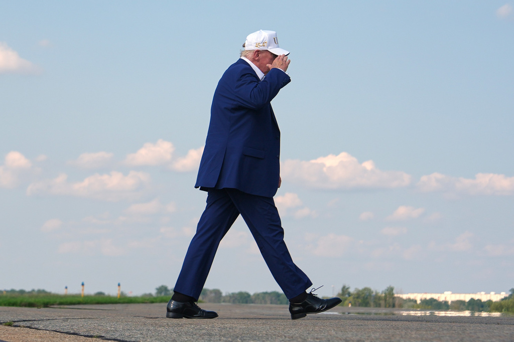 President Donald Trump walks to board Air Force One at Morristown Airport, Sunday, Aug. 9, 2026, in Morristown, N.J. (AP Photo/Julia Demaree Nikhinson)