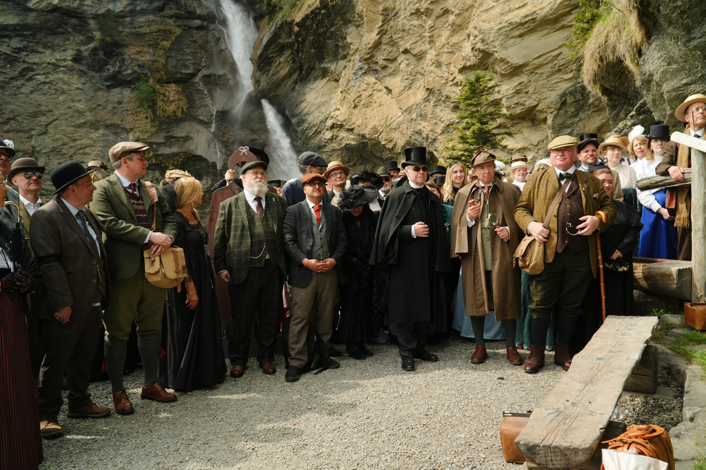 Members of the Sherlock Holmes Society of London recreate the fateful confrontation between Sherlock Holmes and Professor Moriarty at the Reichenbach Falls, Switzerland, May 3, 2026. (AP Photo/Niccolo Lupone, Pool)