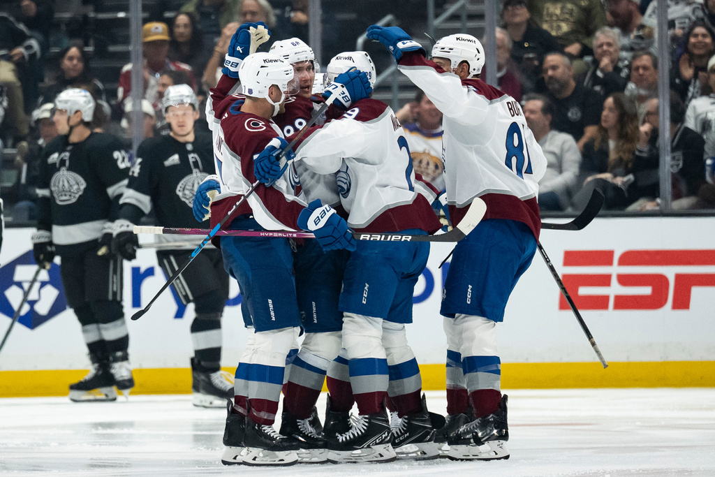 Colorado Avalanche players celebrate a goal by center Martin Necas (88) during the second period of an NHL hockey game against the Los Angeles Kings, Tuesday, Oct. 7, 2025, in Los Angeles. (AP Photo/Kyusung Gong)