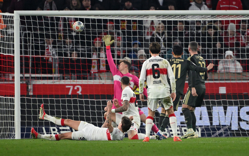 Union Berlin's Woo-yeong Jeong, second from right, scores his side's first goal during the German Bundesliga soccer match between VfB Stuttgart and 1. FC Union Berlin, in Stuttgart, Germany, Sunday, Jan. 18, 2026. (Marijan Murat/dpa via AP)