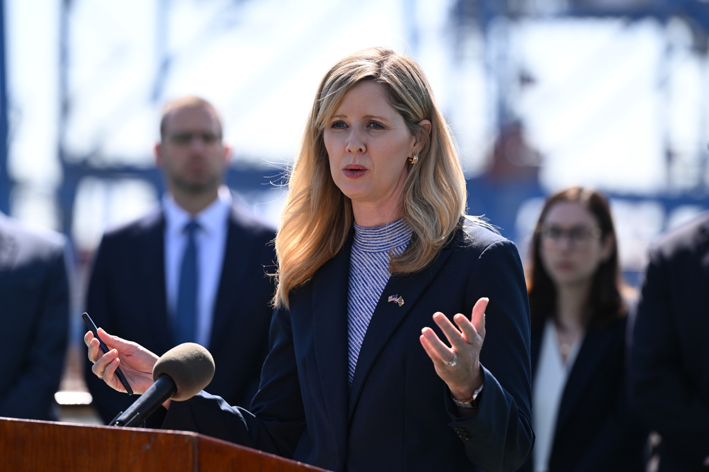 U.S. Attorney for the District of Maryland Kelly O. Hayes, center, updates reporters about the investigation of the Dali container vessel and Francis Scott Key Bridge during a news conference Tuesday, May 12, 2026 in Baltimore. (AP Photo/Gail Burton)