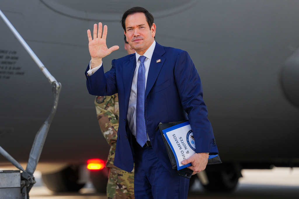 U.S. Secretary of State Marco Rubio waves as he boards a U.S. Air Force C-17 Globemaster III transport aircraft at Bahrain International Airport after his visit to the Middle East, in Manama, Bahrain Thursday, June 25, 2026. (Eric Lee/Pool Photo via AP)