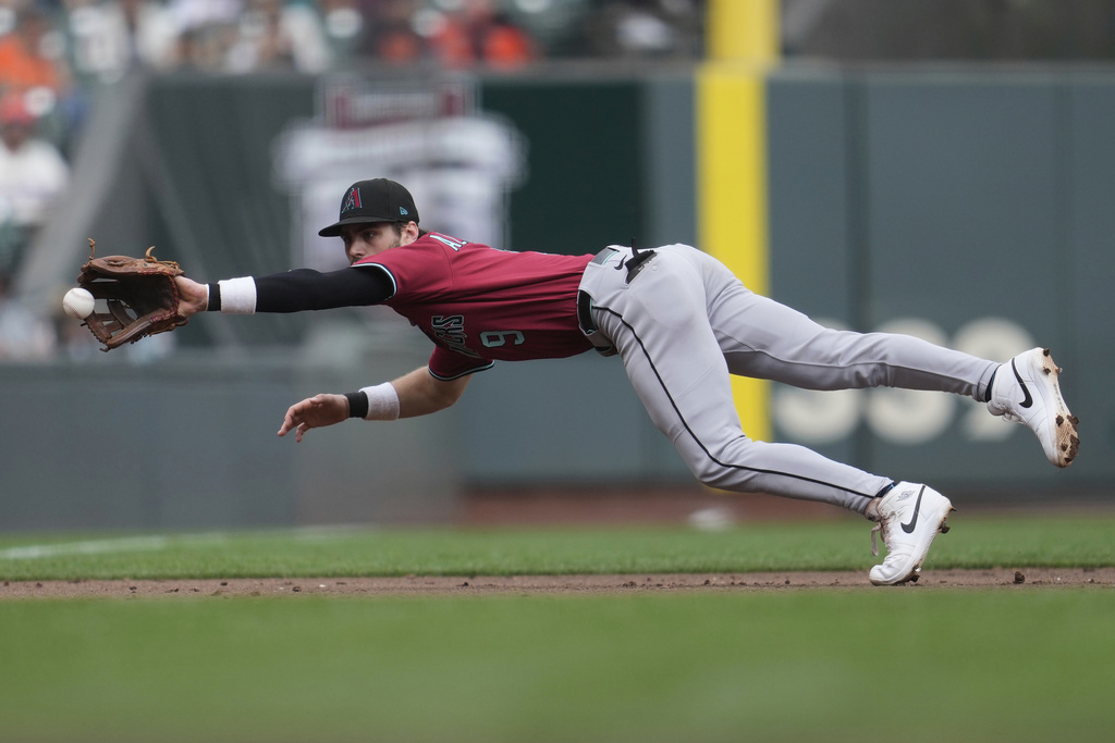Arizona Diamondbacks third baseman Blaze Alexander fields a ground out hit by San Francisco Giants' Luis Matos during the third inning of a baseball game in San Francisco, Wednesday, Sept. 10, 2025. (AP Photo/Jeff Chiu)