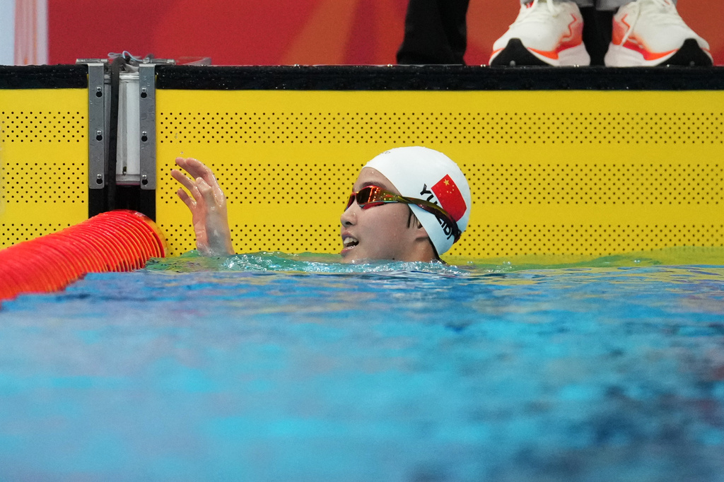 Yu Zidi of China waves after competing in the women's 200-meter individual medley final in swimming at the Asian Games in Tokyo, Japan, Monday, Sept. 21, 2026. (AP Photo/Hiro Komae)