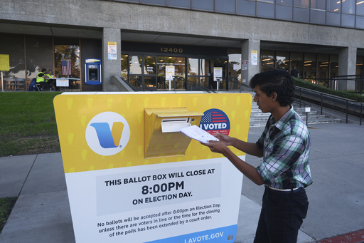 Voter Alex Colcho, from Norwalk, Calif., drops off his family's ballots at a ballot box at the Los Angeles County Registrar-Recorder's headquarters Wednesday, Oct. 29, 2025, in Norwalk, Calif. (AP Photo/Damian Dovarganes) Voter Alex Colcho, from Norwalk, Calif., drops off his family's ballots at a ballot box at the Los Angeles County Registrar-Recorder's headquarters Wednesday, Oct. 29, 2025, in Norwalk, Calif. (AP Photo/Damian Dovarganes)
