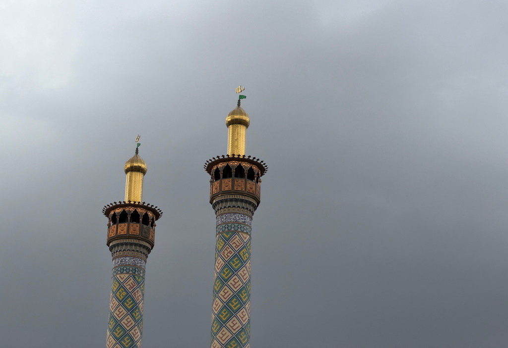 Minarets of a mosque are seen in cloudy weather of Tehran, Iran, Friday, May 8, 2026. (AP Photo/Vahid Salemi)