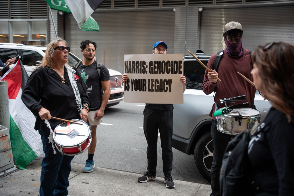 People protest the Israel Palestinian war outside former Vice President Kamala Harris' book tour event for her new book about her presidential campaign, "107 Days," at Town Hall in New York, Wednesday, Sept. 24, 2025. (AP Photo/Angelina Katsanis)