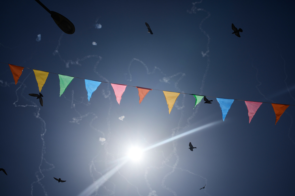 Israeli air defense system fires to intercept missiles during an Iranian attack over Tel Aviv, Israel, Friday, March 6, 2026. (AP Photo/Ohad Zwigenberg)