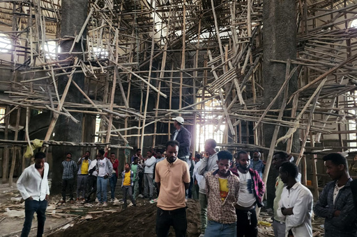 Worshippers stand inside the Menjar Shenkora Arerti Mariam Church under construction that collapsed in Arerti, Amhara region of northern Ethiopia, on Wednesday, Oct. 1, 2025. (AP Photo/Samuel Getachew) Worshippers stand inside the Menjar Shenkora Arerti Mariam Church under construction that collapsed in Arerti, Amhara region of northern Ethiopia, on Wednesday, Oct. 1, 2025. (AP Photo/Samuel Getachew)