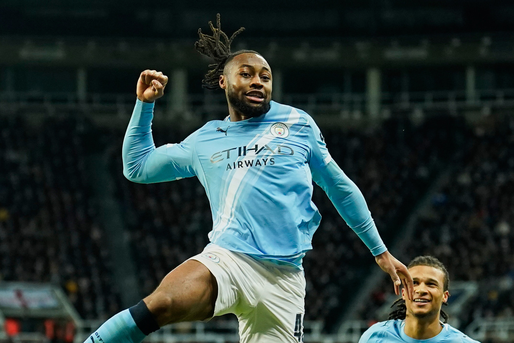 Manchester City's Antoine Semenyo, left, celebrates a goal that was later disallowed by a VAR decision during the English League Cup semifinal first leg soccer match between Newcastle and Manchester City in Newcastle, England, Tuesday, Jan. 13, 2026. (AP Photo/Dave Thompson)