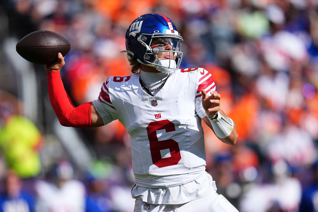 New York Giants quarterback Jaxson Dart (6) passes against the Denver Broncos during the first half of an NFL football game in Denver, Sunday, Oct. 19, 2025. (AP Photo/Jack Dempsey)