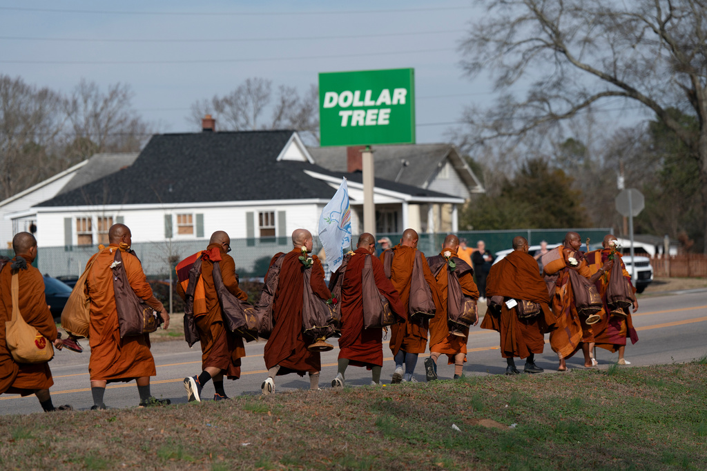 Buddhist monks participate in the, "Walk For Peace," Thursday, Jan. 8, 2026, in Saluda, S.C. (AP Photo/Allison Joyce)