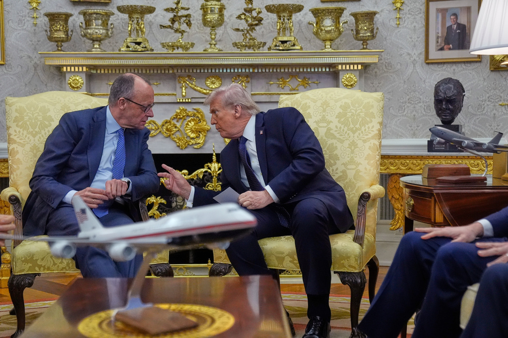 FILE - President Donald Trump meets with German Chancellor Friedrich Merz in the Oval Office at the White House, March 3, 2026, in Washington. (AP Photo/Mark Schiefelbein, File)