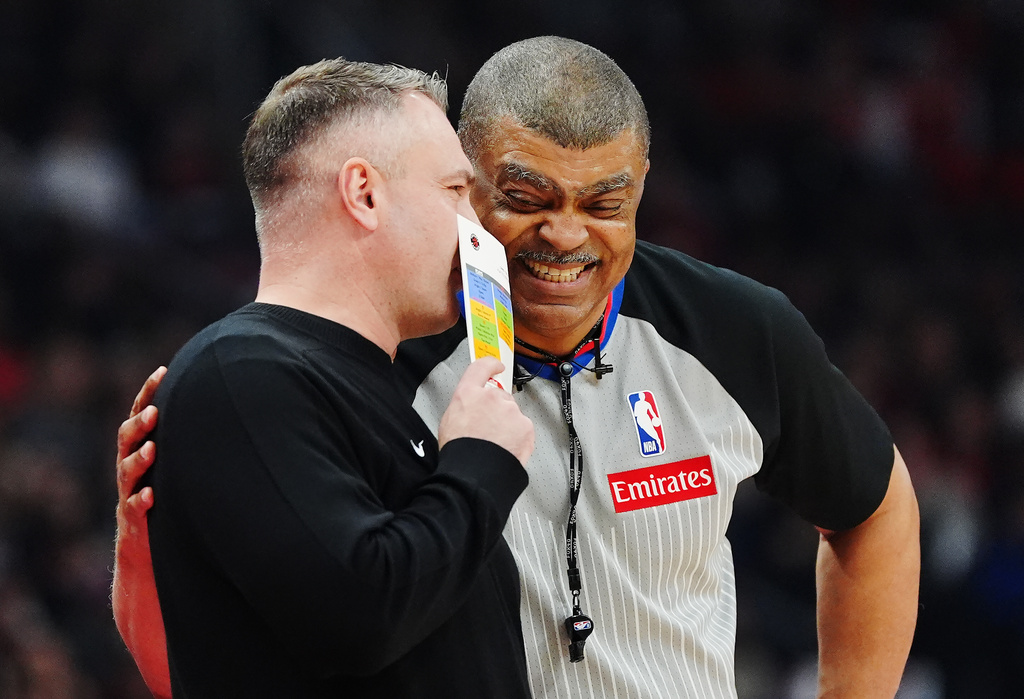 Toronto Raptors head coach Darko Rajakovic, left, talks with referee Tony Brothers, right, during the first half of Game 6 in the first round of an NBA basketball playoffs series against the Cleveland Cavaliers in Toronto, Friday, May 1, 2026. (Frank Gunn/The Canadian Press via AP)