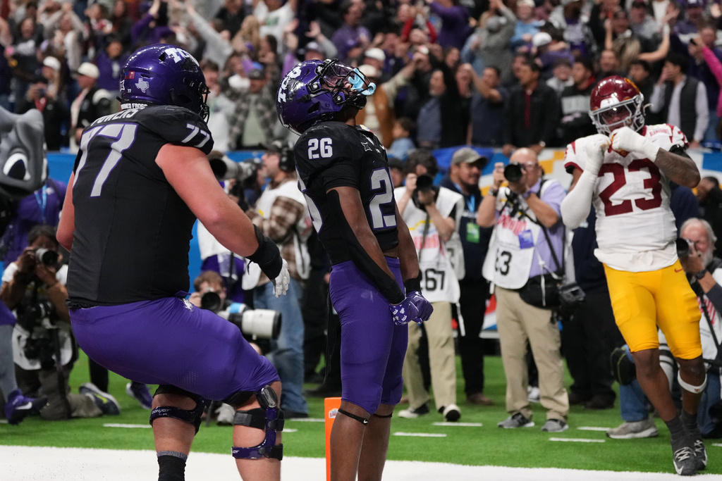 TCU running back Jeremy Payne (26) celebrates after he ran for a touchdown against Southern California during overtime in the Alamo Bowl NCAA college football game in San Antonio, Tuesday, Dec. 30, 2025. (AP Photo/Eric Gay)