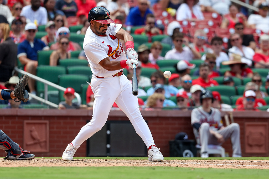 St. Louis Cardinals' José Fermín hits a two-run single during the sixth inning of a baseball game against the Atlanta Braves, Sunday, July 12, 2026, in St. Louis. (AP Photo/Scott Kane)